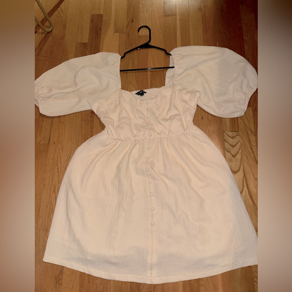 J.NNA White midi dress with mid length sleeves. Only sold through app.
